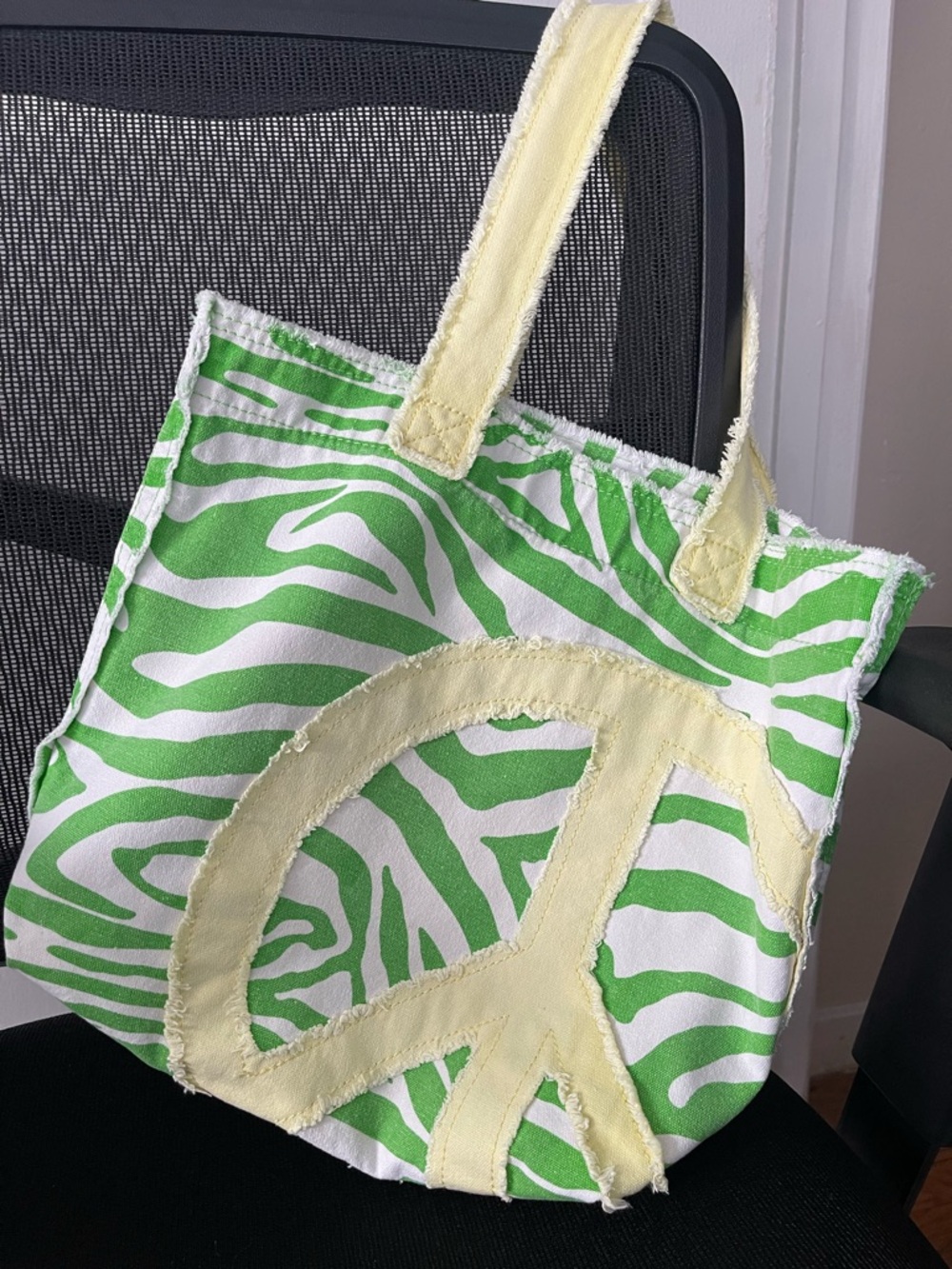 Green Zebra Print Canvas Tote Bag with Yellow Peace Sign and velcro close.